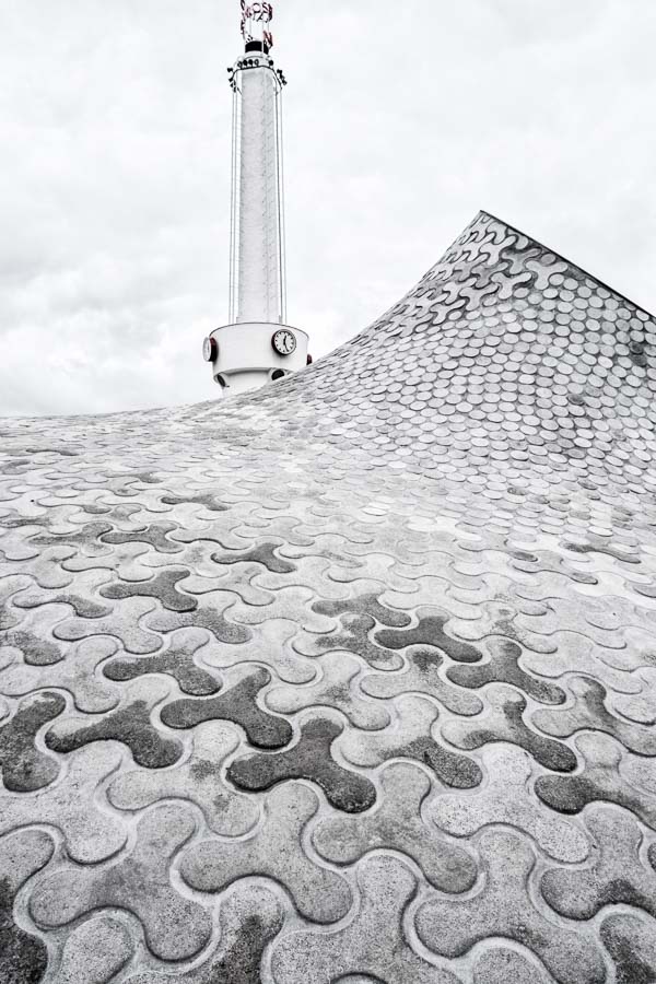 undulating paving stones and tower of amos rex in helsinki