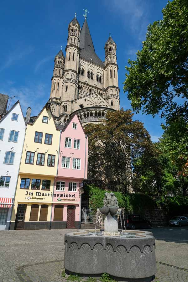 small pretty square with fountain and church steeple