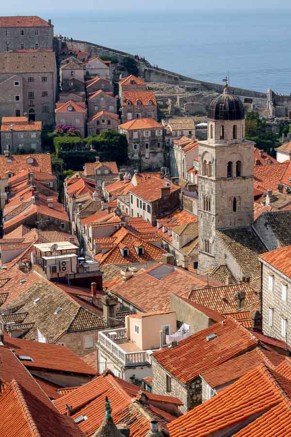 terracotta rooftops of dubrovnik with church bell tower