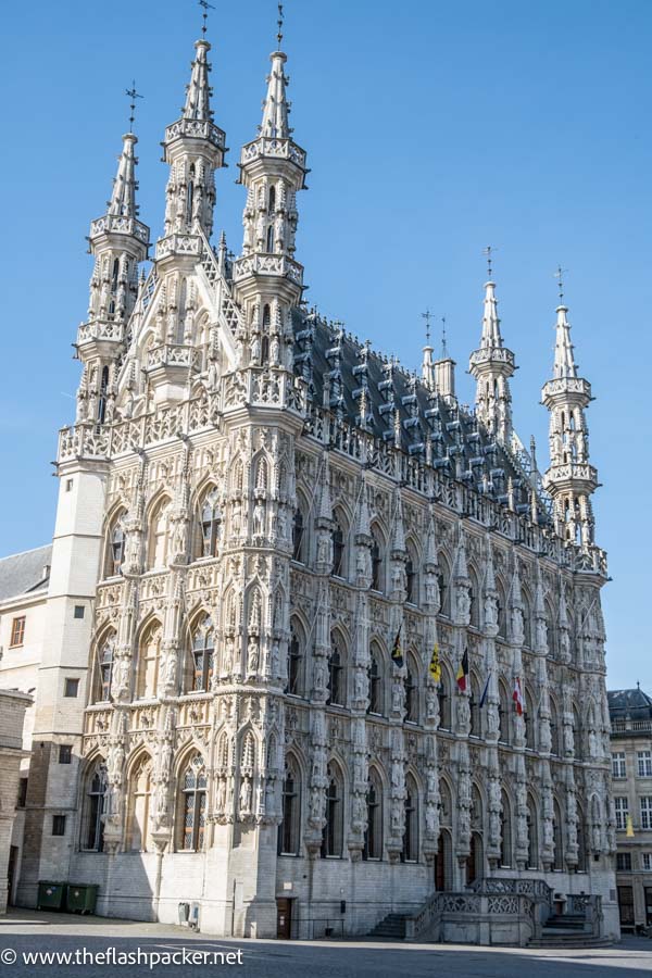 elaborate gothic exterior of the town hall seen when visiting leuven belgium