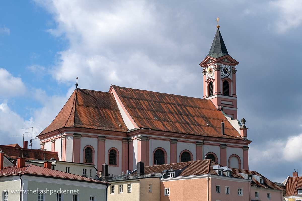 pink and white church with bell tower