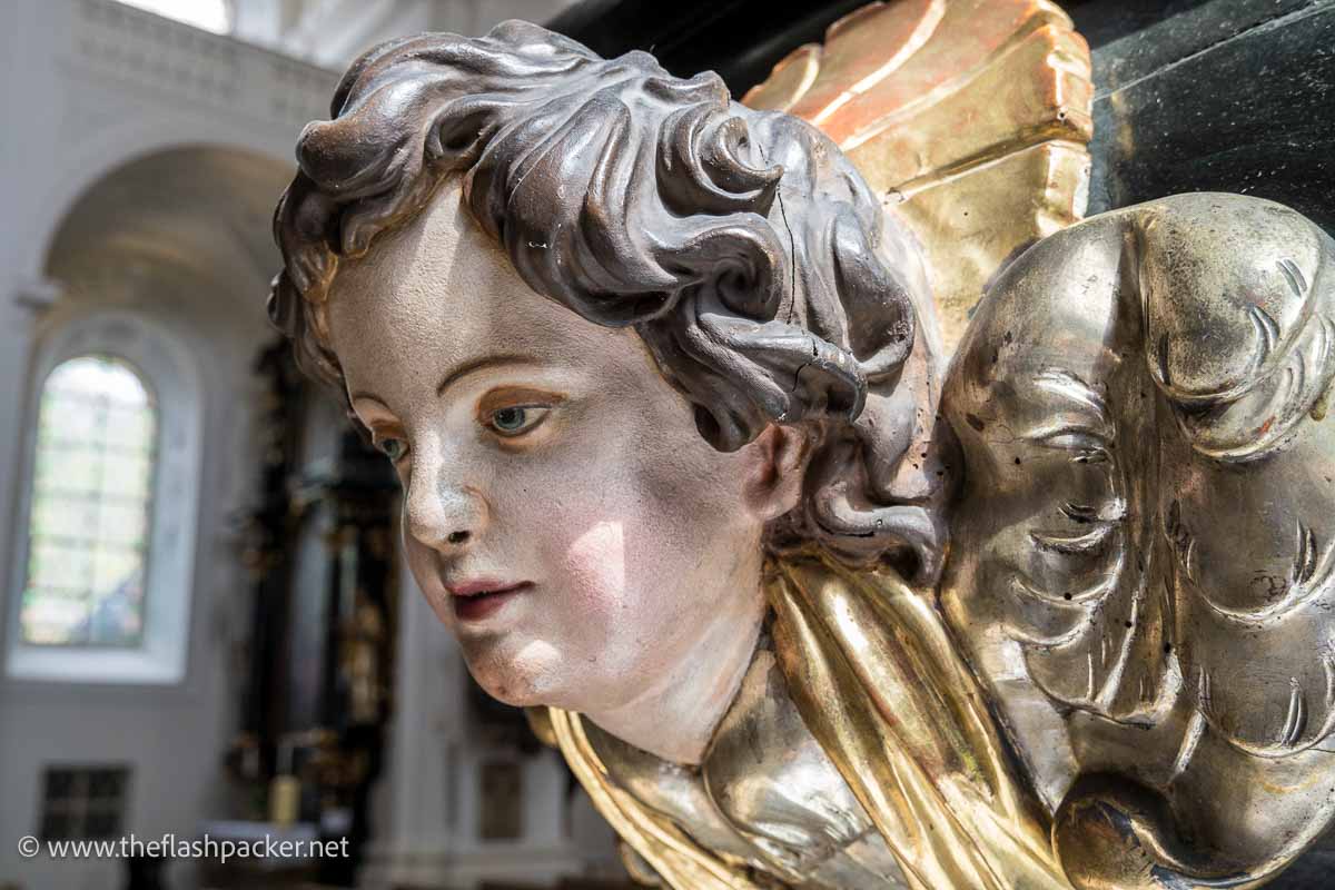 painted wooden carving of an angel