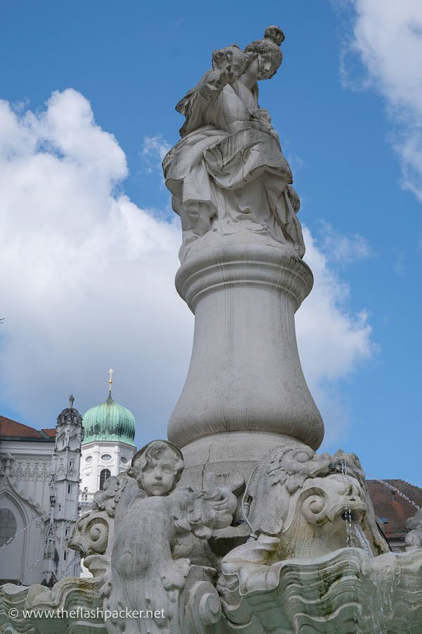 elaborate baroque fountain with sculptures spouting water