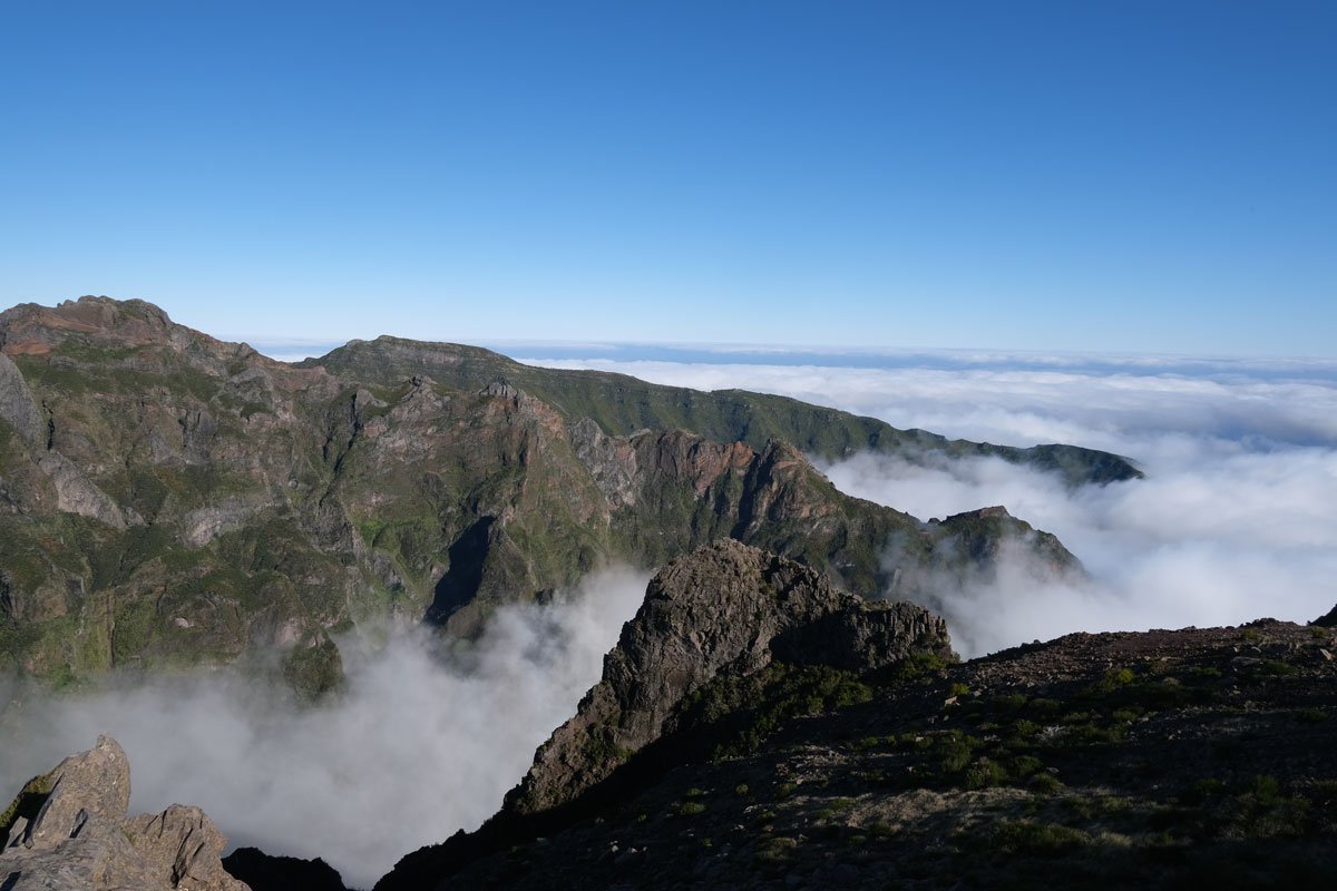 swirling cloud brushing the jagged peaks of mountains in madeira portugal