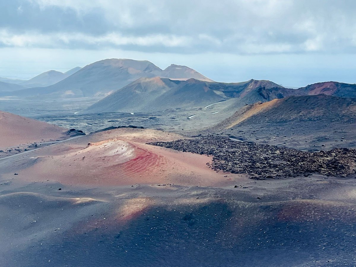 One Week in Lanzarote: Sun, Sea and Surreal Landscapes 1 volcanic landscape with extinct volcanos and brown and red earth is one of the places to visit in Lanzarote in one week