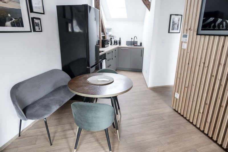 kitchen and table and chairs in an apartment