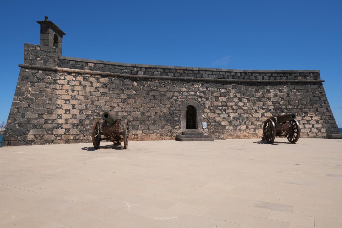 low stone fortress with two cannons
