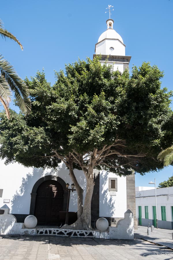 old whitewashed church with bell tower