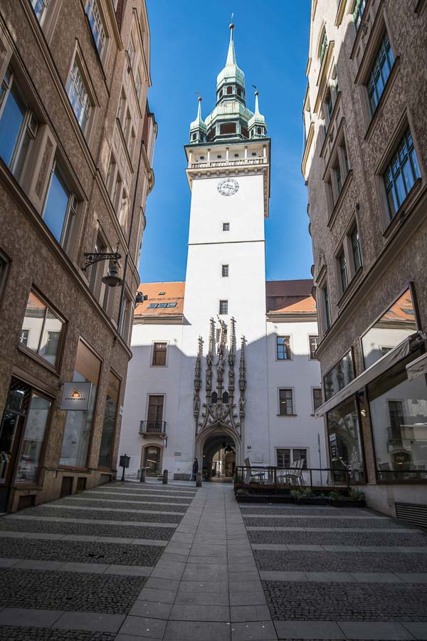white frontage and clock tower of old town hall in brno