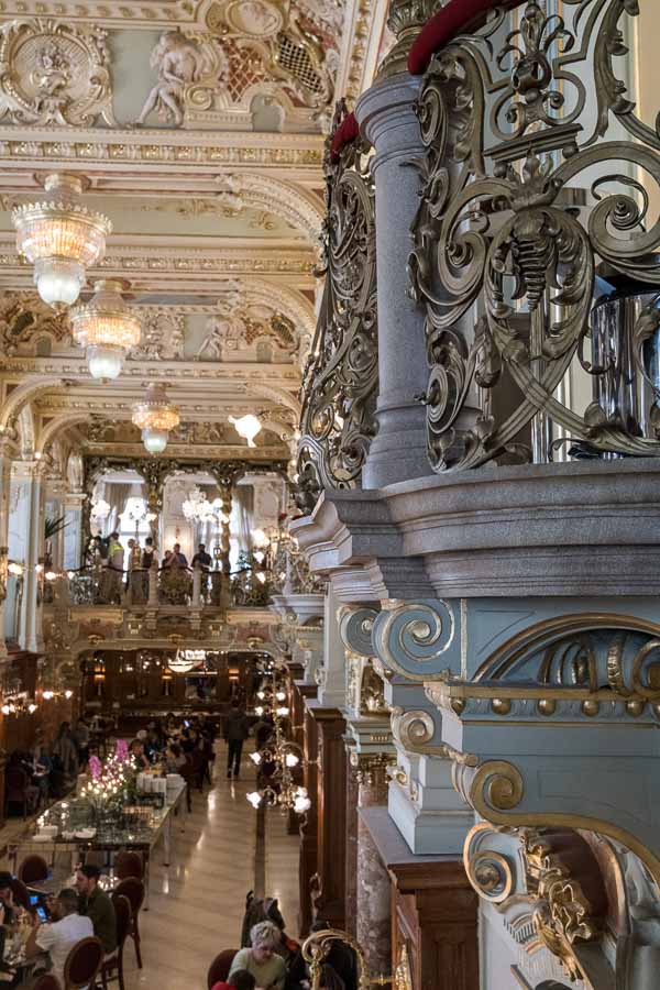 gilded grey marble and wrought iron balustrade of budapest new york cafe