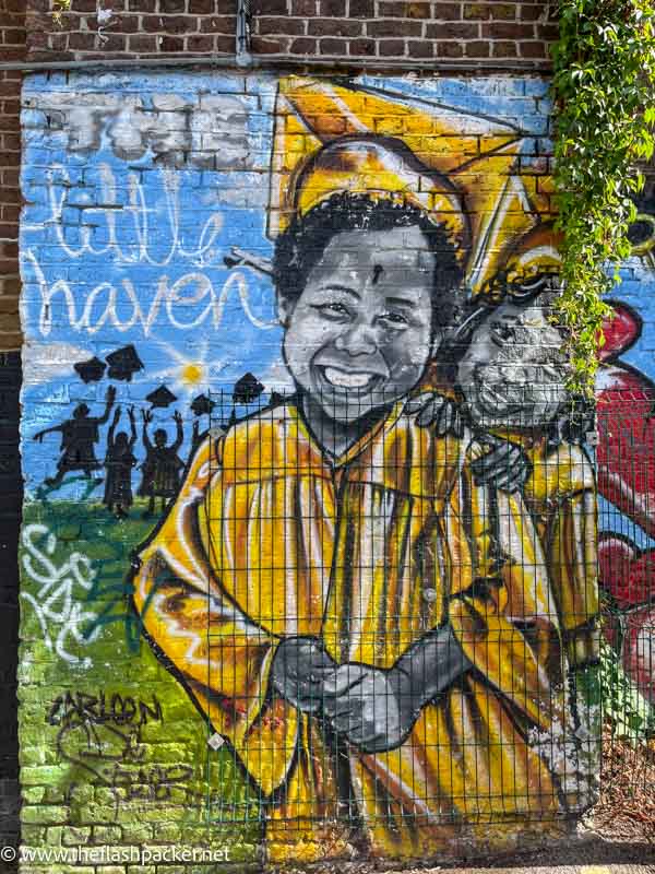 wall mural of a smiling mother and child in african dress