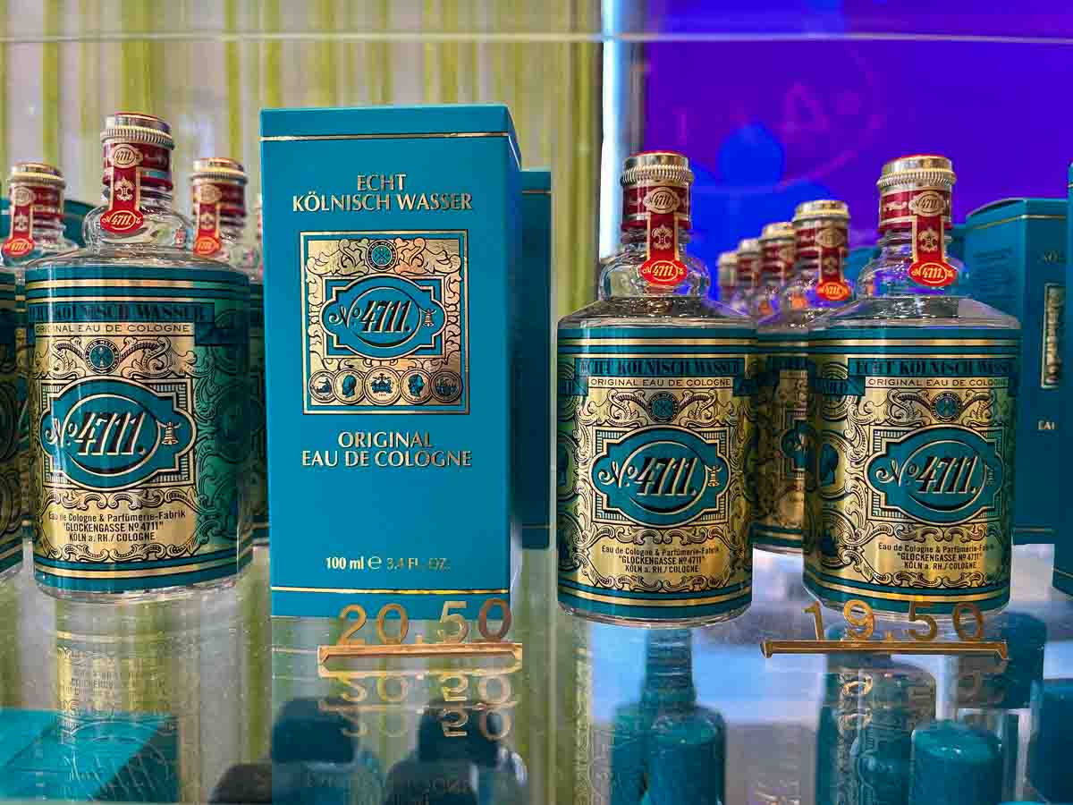bottles of 4711 cologne on a glass shelf