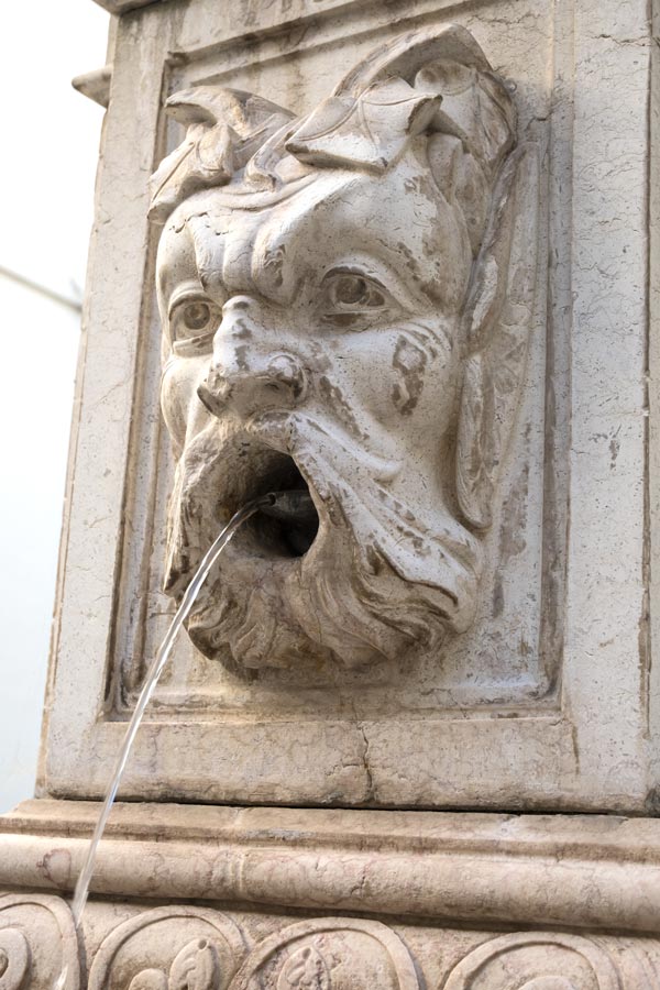 fountain if face of mythical being gushing water
