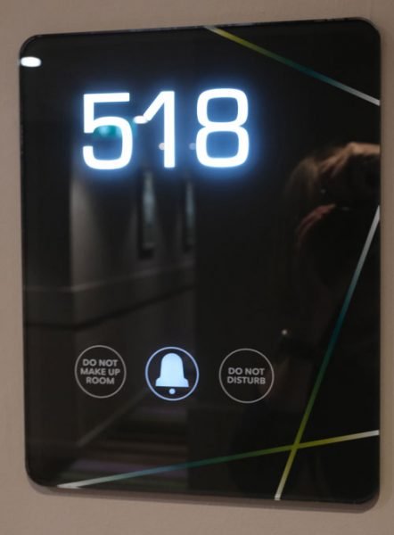 illuminated hotel room sign with the number 518