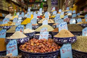 men standing behind spice stall