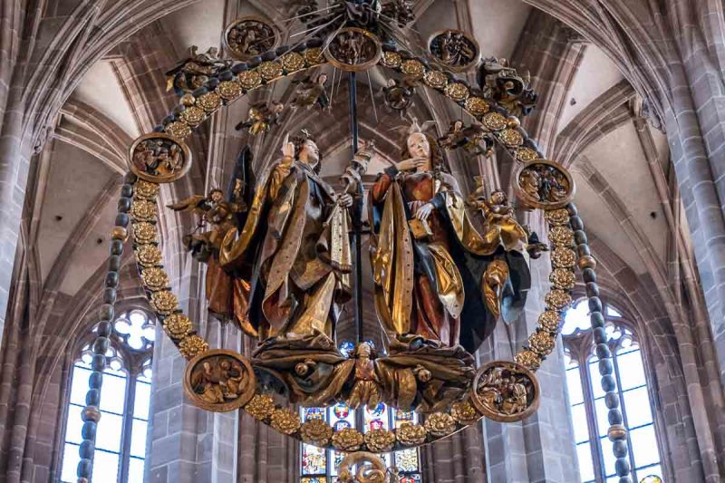 wooden sculpture of angel gabriel and mary