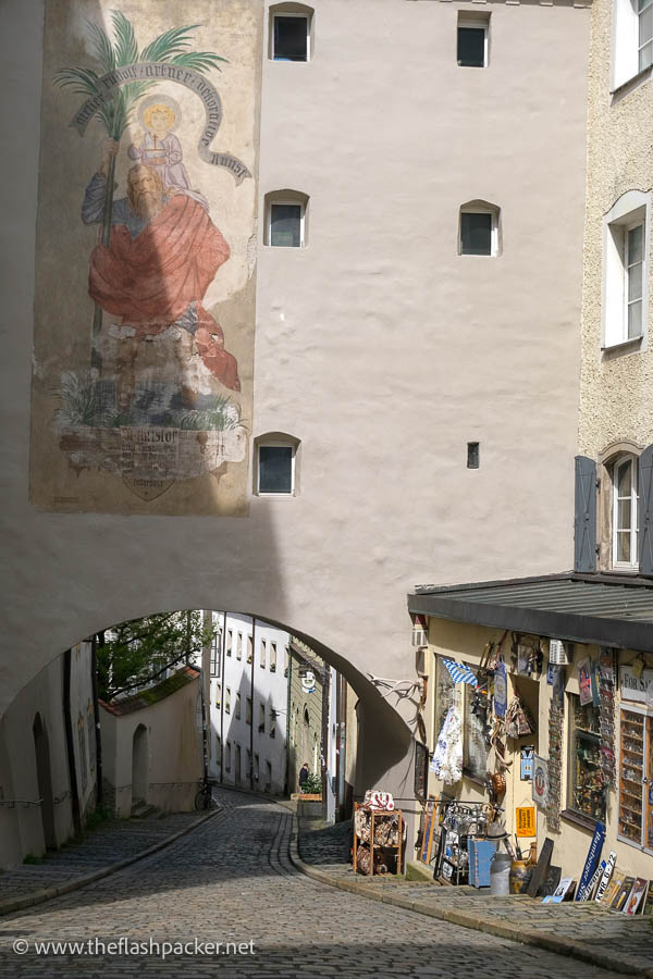 large fresco painted over the arch of a building
