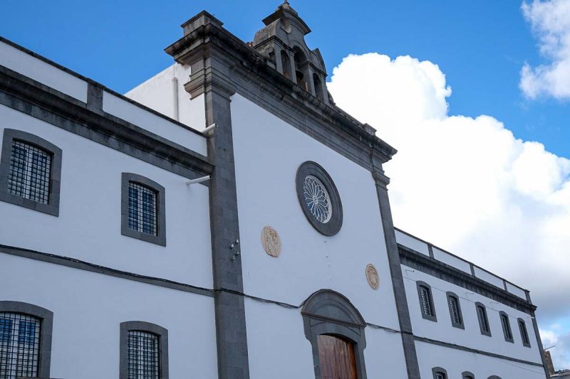 white edifice of convent building with grey brick work