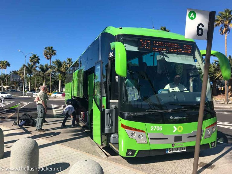 people boarding a green TITSA bus in Tenerife