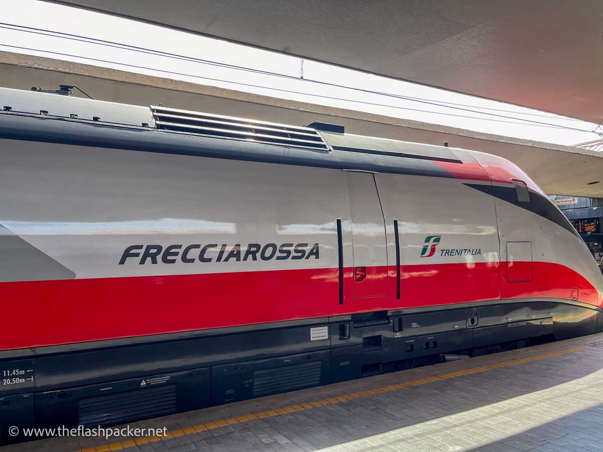 red and grey trenitalia high speed train in italy