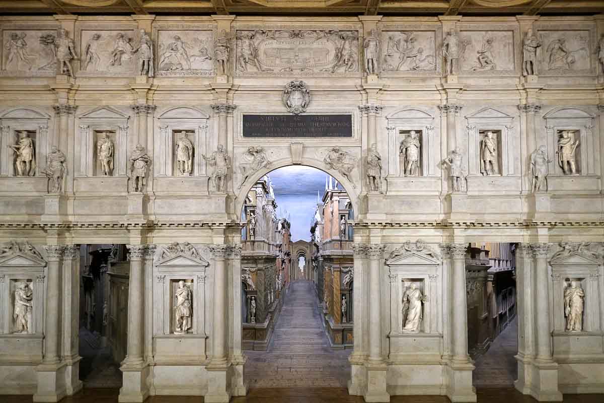 stage of vicenza olympic theatre with backdrop of small statues in niches