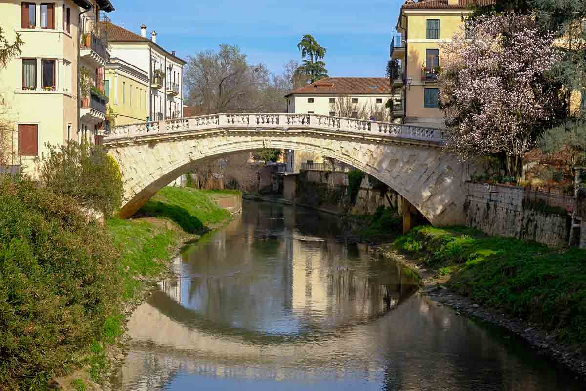 elegant stone bridge of st michael reflected in the river in vicenza italy