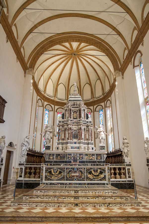 elaborate marble altar under a ribbed and domed ceiling in santa corona church in vicenza italy