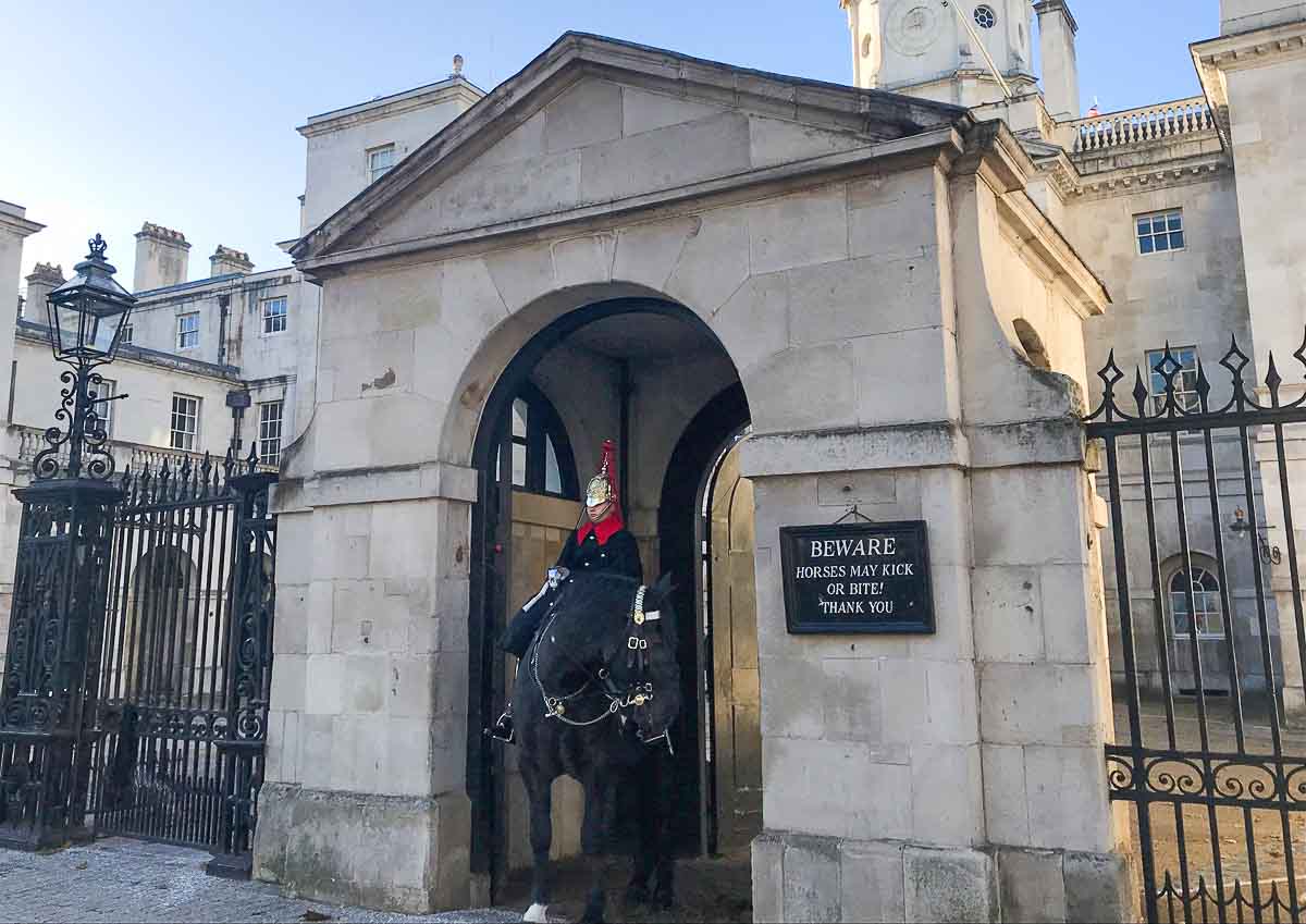22 Old Streets of London: Historic Roads You MUST Visit 1 soldier on horseback guarding entrance on whitehall one of londons old streets