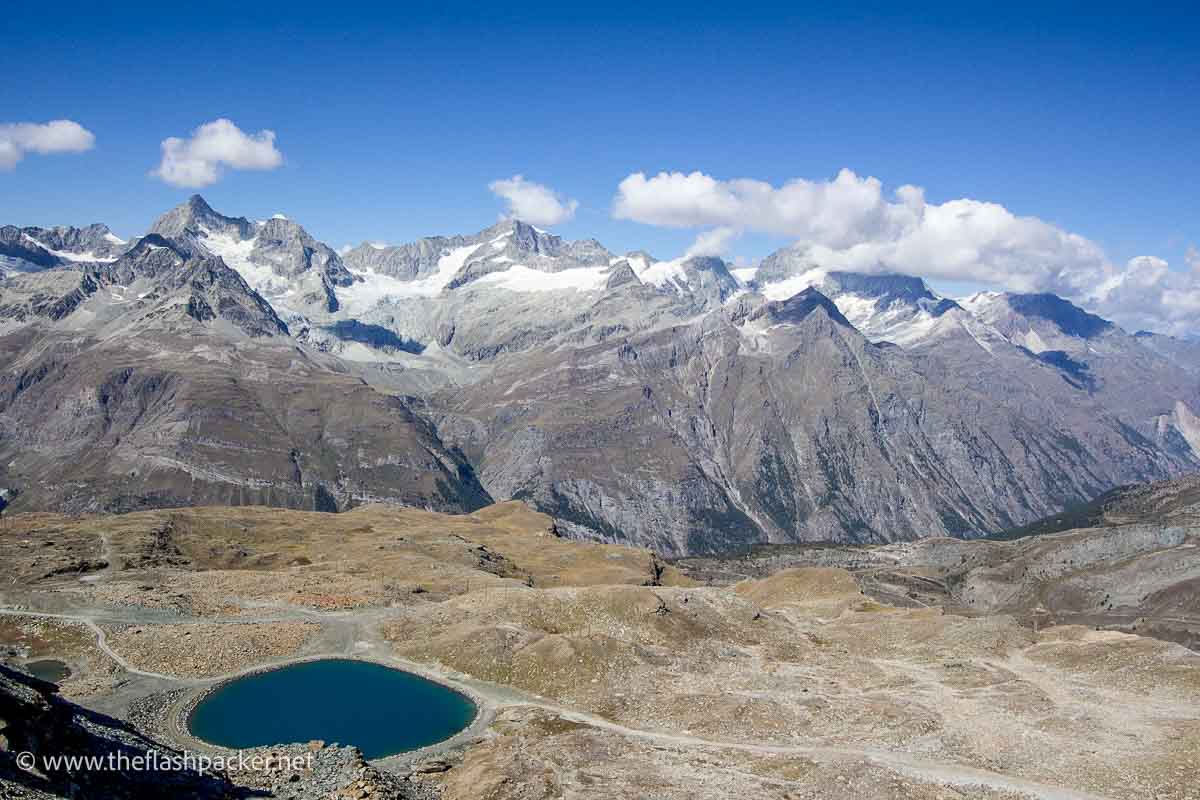 My Guide to Zermatt for Non-Skiers 1 snow capped mountains behind glacier field with pool of water
